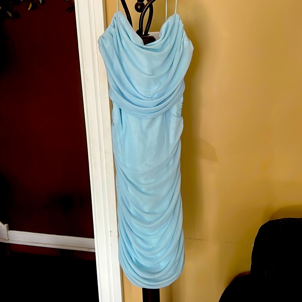 Only worn once! Very cute ruffled blue dress! I can send more pics of it too!:)